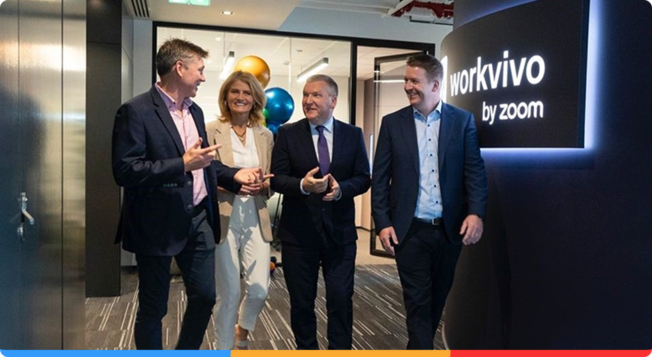 Workvivo Employees Walking and Talking in their Office Hall